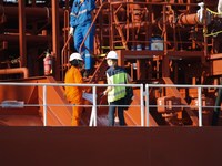 A volunteer visits a ship